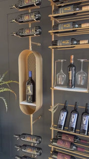 Fittings Metal Collection showroom with gold wine walls and a wine capsule, video by Fittings