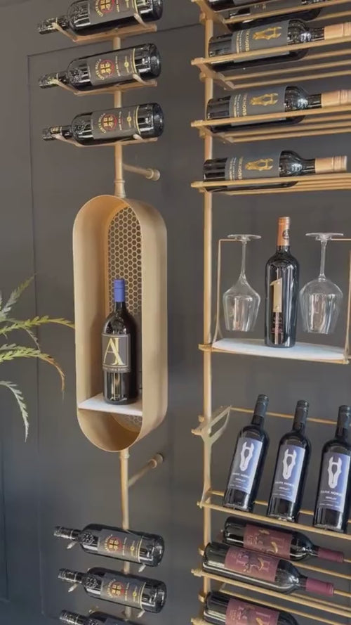 Fittings Metal Collection showroom with gold wine walls and a wine capsule, video by Fittings