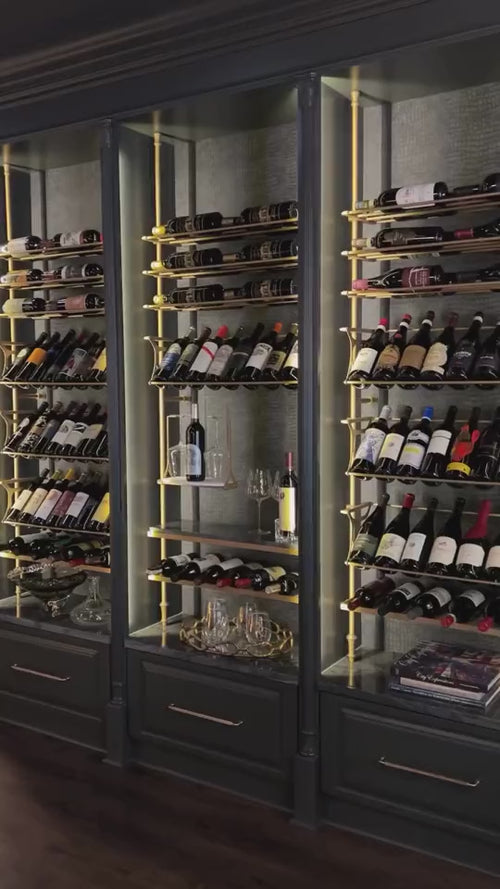 Fittings gold wine racks built into dark cabinetry, video by Fittings