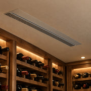 Illustration of a recessed CS025 ceiling fan coil above wooden wine racks