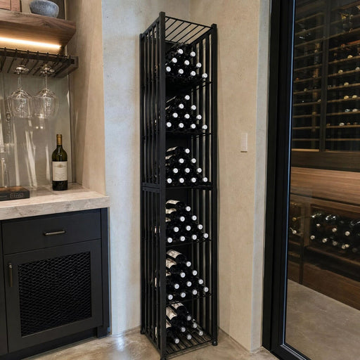 Tall metal wine bin storage full of bottles in a residential wine cellar